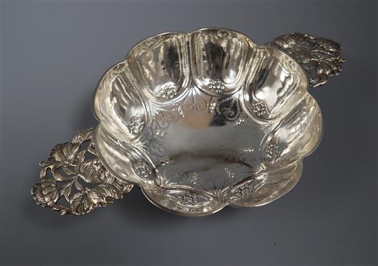 An early 20th century Dutch embossed silver lobed quaich, import marks for Samuel Boyce Landeck, Chester, 1902, 7 oz.